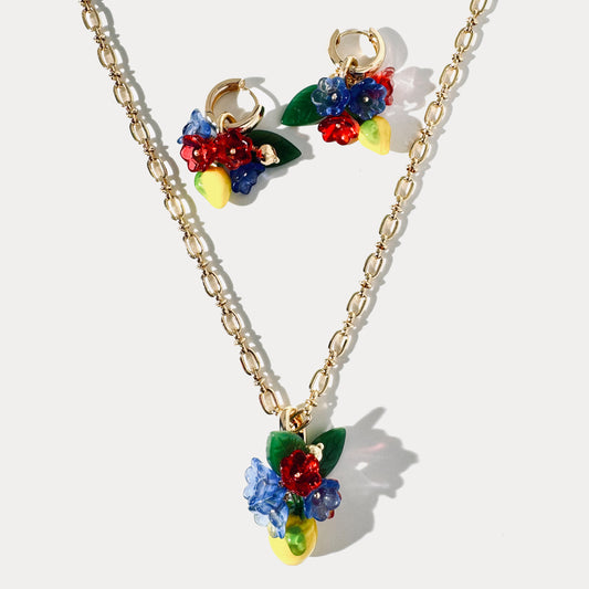 Handcrafted jewelry set with glass lemon and flower pendant necklace and matching 18K gold-plated earrings featuring glass lemons and flowers